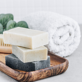 Soap. Organic soap bars. Stack of natural soap bars on gray stone background, copy space.